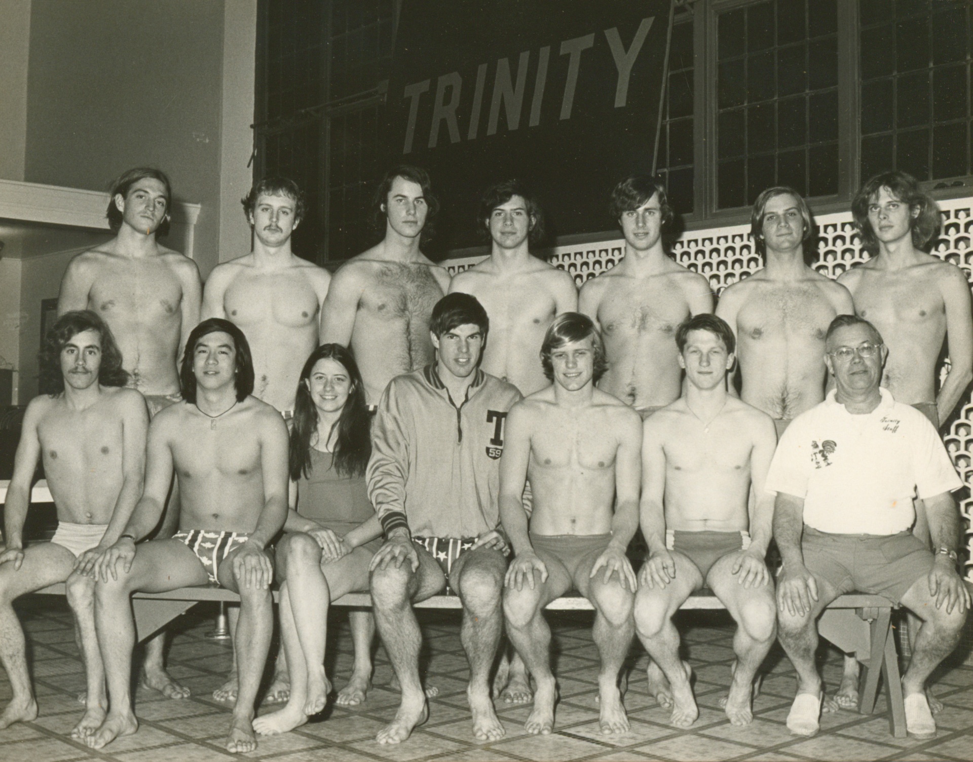 Team photograph of the Trinity College swim team in the 1970s. Barbara Clark stands among the male swimmers in the front row.